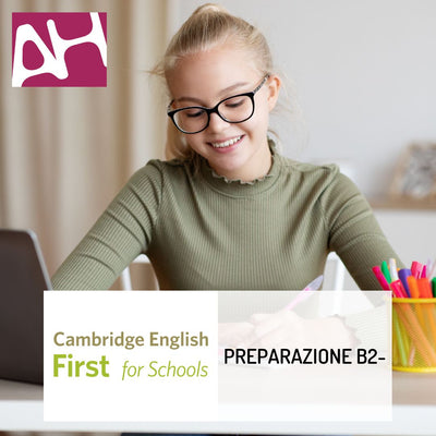 Ragazza che sorride al computer con in sovraimpressione logo AH e logo First for schools e la scritta "PREPARAZIONE B2-"